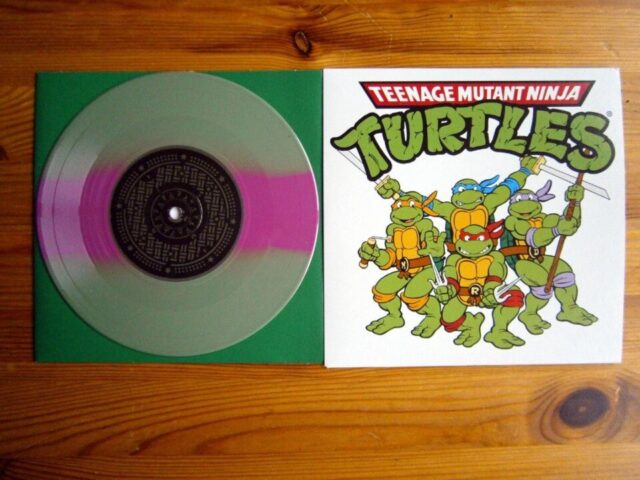 Album: Let's Kick Shell!
Artist(s): Teenage Mutant Ninja Turtles
Label: Enjoy The Toons Records (@enjoythetoons), 2016
Games: Teenage Mutant Ninja Turtles: Turtles In Time

Back in January, 2016 seemingly out of nowhere this little EP was announced and released by Enjoy The Toons. And before the official Ninja Turtles art confuses anyone - this is actually a cover EP. It features rock covers of two tracks from the original animated series and three from the Turtles In Time video game. However, Enjoy The Toons did work together with Viacom/Nickelodeon to properly use the TMNT rights hence the artwork. I am curious about the story of how (and why) this came to be, though.

Personally I quite like the tracks, although they did receive a mixed reception from people at its release and I will agree that it's hard to compete with the originals (especially the legendary theme song from the TV show), but taken for what it is the band here (for some reason the band called themselves Teenage Mutant Ninja Turtles too for just this one release) did a pretty good job.

This particular copy is the 7" version on "Donatello" green and purple vinyl, which neatly imitates the Turtles' mask (of course it also came in red, blue and orange variants). It also came with a Donatello cardboard mask and a vintage trading card! This version was limited to 200 copies, and the myriad of other color variants were similarly limited from 100-400 copies each. The 7" version is long sold out, but it was recently reissued as a single-sided 12" with a screen printed b-side. This one's also sold out, but the label have been repressing them gradually, so it's probably better to wait than resorting to scalpers (as of now there are 24 different variants of this EP on Discogs!).

#vinyl #instavinyl #vgmvinyl #vgm #videogamemusic #gaming #blipblop #records #gamemusic #soundtrack #music #videogamevinyl #vinylcollector #vinylcollection #vinylrecords #nowspinning #nowplaying #nowlistening #vinyljunkie #vinyligclub #igvinyl #teenagemutantninjaturtles #tmnt #enjoythetoons #enjoytheride